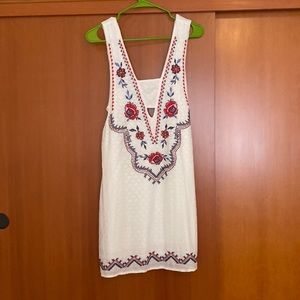 Xhiliration dress. Embroidery detail and side cut outs.